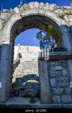 An ancient stone arch in a street of Fontanarosa, a small village in the province of Avellino, Italy. Stock Photo