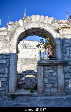 An ancient stone arch in a street of Fontanarosa, a small village in the province of Avellino, Italy. Stock Photo