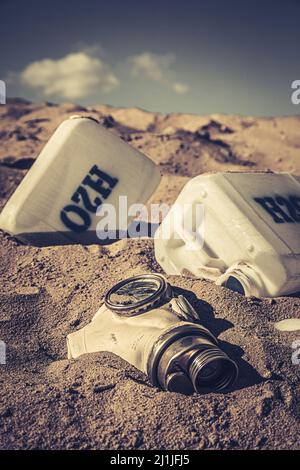 Unclean water cans in polluted and danger area. Climate change on earth and lack of drinking water. Stock Photo