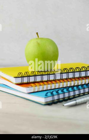 black to school concept with apple on notepad on table. Stock Photo