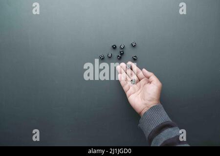 Black Dice trowing on black background top view  Stock Photo
