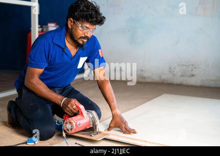 aluminium worker marking wood for design and renovation work at construction site - concept of skilled ocupation, blue collar jobs and home or office Stock Photo