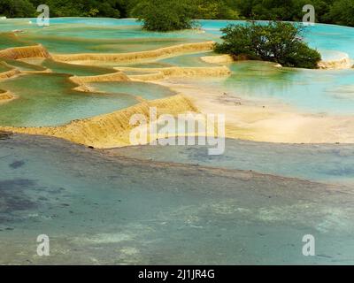 A natural blue pool in Huanglong national park in Sichuan, China Stock Photo