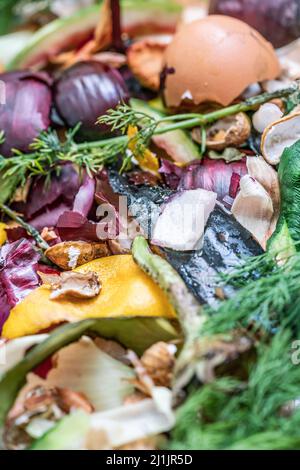 decomposed garbage, composting pile of rotting kitchen scraps, top view  pile of vegetables, fruits, organic waste as a background with selective focu Stock Photo