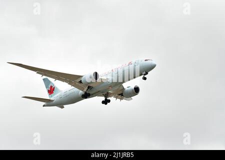 A passenger airplane lands at Pearson international airport in Toronto Canada in cloudy weather Stock Photo