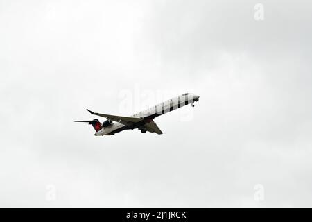 A passenger airplane lands at Pearson international airport in Toronto Canada in cloudy weather Stock Photo