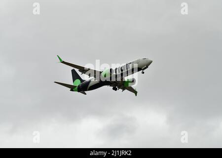 A passenger airplane lands at Pearson international airport in Toronto Canada in cloudy weather Stock Photo