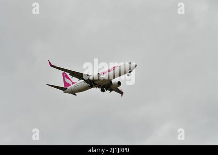 A passenger airplane lands at Pearson international airport in Toronto Canada in cloudy weather Stock Photo