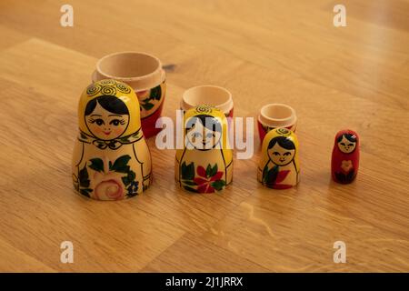 Set of traditional Russian wooden babushka dolls - matrioshka. Stacking or nested doll typical to Russia. Matrioshka brain concept. Stock Photo