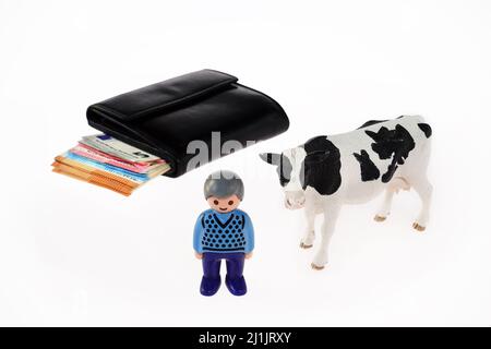 a Cow, a Farmer and a Wallet Stock Photo