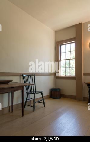 A colonial kitchen with table and chair Stock Photo