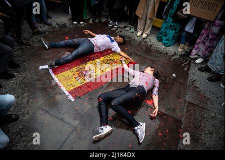 Madrid, Spain. 26th Mar, 2022. Two protesters are seen making a performance covered with fake blood during a demonstration where Saharawi community and supporters are protesting in front of the Ministry of Foreign Affairs. Thousands have gathered to protest against the Spanish government's support for Morocco's autonomy plan for Western Sahara, which grants a limited autonomy to Western Sahara. Pro-independence groups as well as Algeria oppose the proposal. Credit: Marcos del Mazo/Alamy Live News Stock Photo