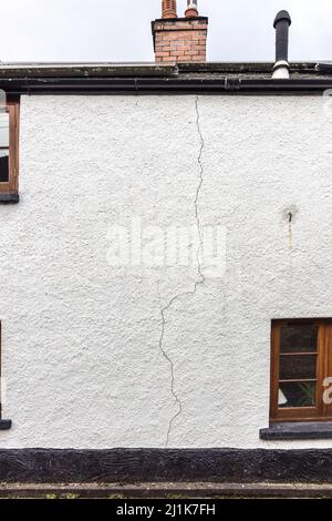 Crack in render on house wall, Llanfoist, Wales, UK Stock Photo