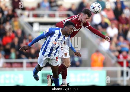 Hartlepool United's Nicky Featherstone (right) heads the ball away from Northampton Town's Jon Guthrie during the Sky Bet League Two match at Sixfields Stadium, Northampton. Picture date: Saturday March 26, 2022.