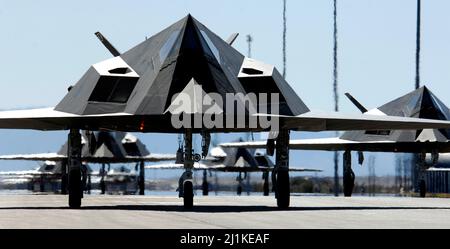 Holloman Air Force Base, United States. 28 October, 2006. Twenty-five U.S. Air Force F-117 Nighthawk stealth fighter aircraft line up for take-off to celebrate the 25th anniversary of the first combat stealth fighter at Holloman Air Force Base, June 8, 2012 in Alamogordo, New Mexico.  Credit: SrA Brian Ferguson/US Air Force/Alamy Live News Stock Photo