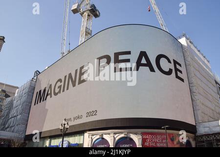 London, UK. 26th March 2022. Yoko Ono's 'Imagine Peace' message displayed on Piccadilly Lights in Piccadilly Circus. Thousands of people marched from Park Lane to Trafalgar Square in solidarity with Ukraine as Russia continues its attack. Credit: Vuk Valcic/Alamy Live News Stock Photo