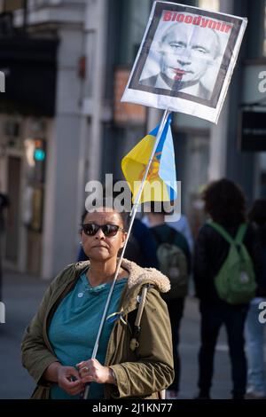 Ukrainian and British anti-War protesters march through central London against the Russian invasion of Ukraine, on 26th March 2022, in London, England. The march through was organised by London Mayor, Sadiq Khan. Stock Photo