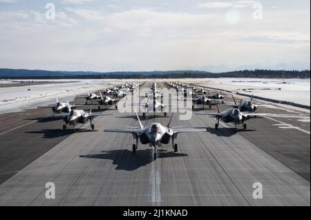 Fairbanks, United States. 25th Mar, 2022. A formation of U.S. Air Force F-35 Lightning II aircraft assigned to the 354th Fighter Wing, perform an Elephant Walk at Eielson Air Force Base March 25, 2022 in Fairbanks, Alaska. An Elephant Walk is a maneuver to scramble fighter aircraft using minimum interval takeoff. Credit: A1C Jose Miguel Tamondong/U.S Air Force/Alamy Live News Stock Photo