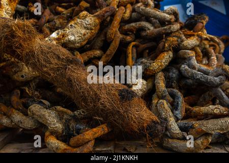 Close-up of rusted metal chains from a ship's anchor. Background image with nautical theme Stock Photo