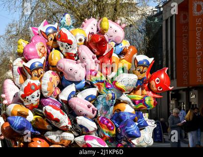 Cardiff, Wales - March 2022: Huge bunch of helium filled balloons being sold on a street in ther city centre Stock Photo