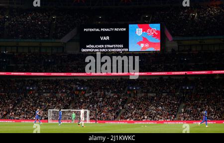 The big screen shows a VAR check for a penalty against Arsenal which is ...