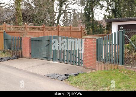 a new house with a driveway gate Stock Photo