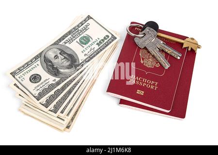 a bundle of dollars, keys and documents on a white background Stock Photo