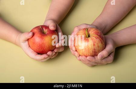 juicy, fresh, red apples in the hands of a child Stock Photo