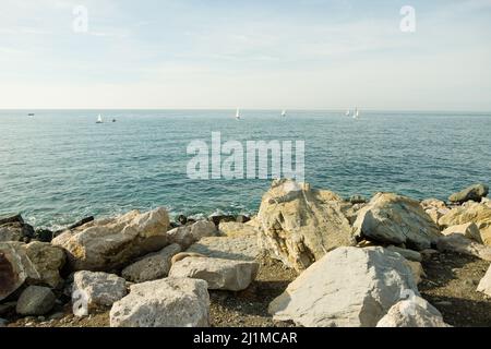 Sea Waves On Rocky Beach, beautiful close-up footage of a sea waves washing up beach pebbles. Beutiful coastline, horizontal. Waves are reaching Stock Photo