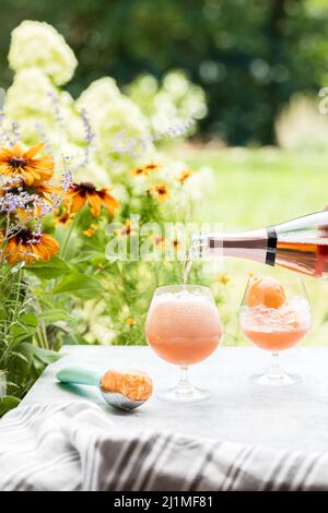 Champaign Floats Served Outdoors on a Summer Patio with Sherbet and Rose Bubbles Stock Photo