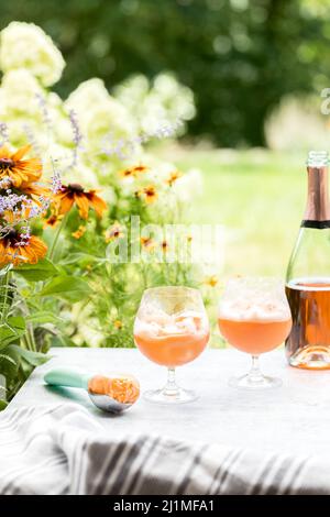 Champaign Floats Served Outdoors on a Summer Patio with Sherbet and Rose Bubbles Stock Photo
