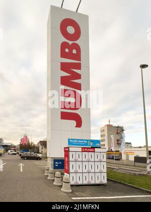 Basel, Switzerland - Dec 20, 2021: Large logotype ooh of Jumbo DIY Home improvement store in central Basel Stock Photo