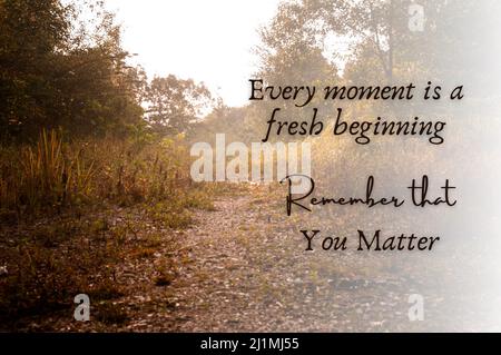 Motivational and inpirational quote - Every moment is a fresh beginning. With blurred nature pathway background. Motivational concept Stock Photo
