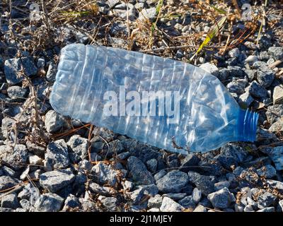 An empty discarded plastic water bottle. Quebec,Canada Stock Photo