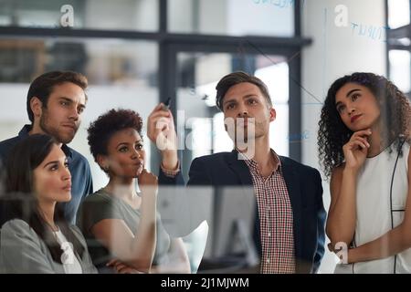 Looking at the numbers from all angles. Shot of a well dressed businesswoman giving a presentation to her colleagues in the boardroom. Stock Photo