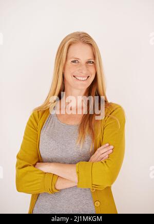 Ready for a brand new day. Portrait of a confident woman standing with her arms crossed. Stock Photo