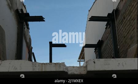 Heavy duty steel supports attached to wall at town centre building site, Andalusia Stock Photo