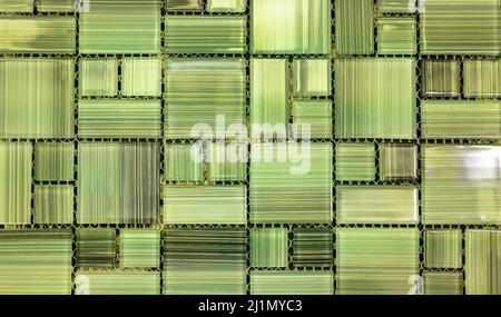 Abstract green background. Small green modern mosaic tile in bathroom. glass ceramic texture. green mosaic wall Stock Photo