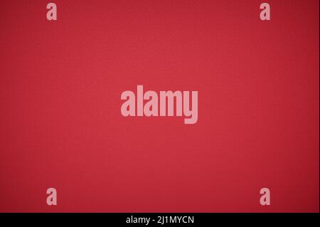 Closeup of red fabric textile material as texture or background. Red Background With Textures and Vignette. Close up view of red woolen fabric texture Stock Photo