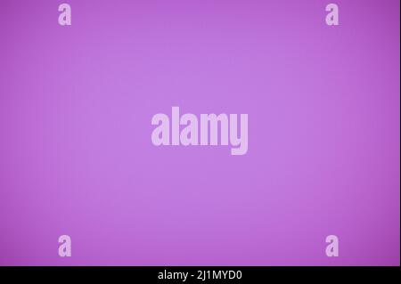 Close up view of purple woolen fabric texture. Closeup of violet fabric textile material as texture or background. Very peri Background With Textures Stock Photo