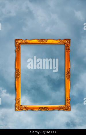empty ornate, golden picture frame in the sky Stock Photo