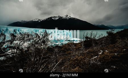 A dramatic photo of the landscape surrounding the world famous Perito Moreno glacier in Argentine Patagonia. Dark Cloudy adn rainy  weather Stock Photo