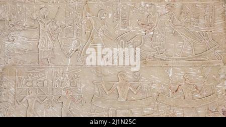 Cairo, Egyptian Museum, tomb of Harmin, a large relief : First register, the deceased is  in bark with the Benu bird, he kills a snake. Stock Photo