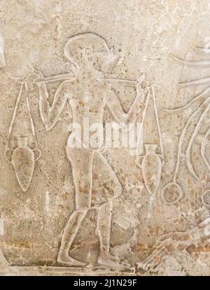 Cairo, Egyptian Museum, from Guiza, tomb of Ptahmay, young boy bringing vases, thanks to a yoke. Stock Photo