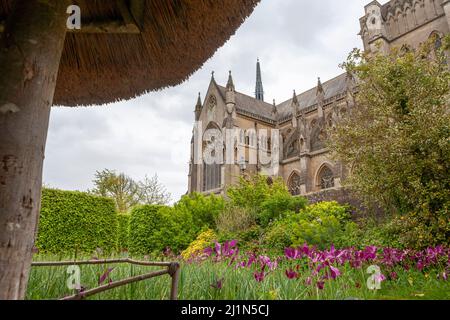 View of Arundel Cathedral from the thatched summerhouse in the Arundel Castle Gardens, West Sussex, UK Stock Photo