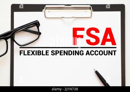 Paper with Flexible Spending Account FSA on a table Stock Photo