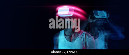 Creative collage in neon colors of fit african american man in VR headset, standing over dark background, panorama Stock Photo