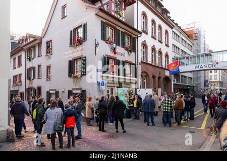 Basel, Switzerland - February 21. Carnival revellers meeting in front of a restaurant Stock Photo