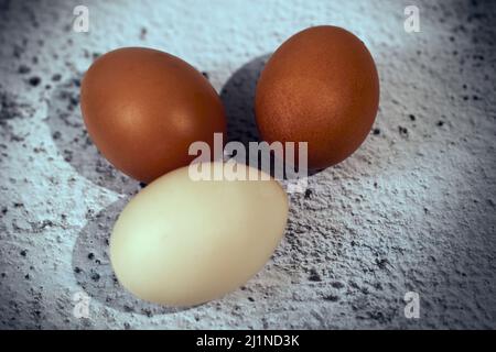 Easter composition. Three eggs on a gray background Stock Photo