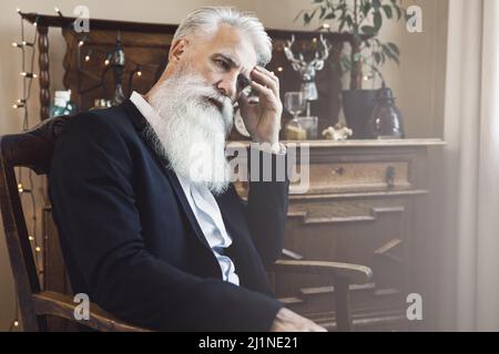 Handsome bearded senior man posing in studio Stock Photo